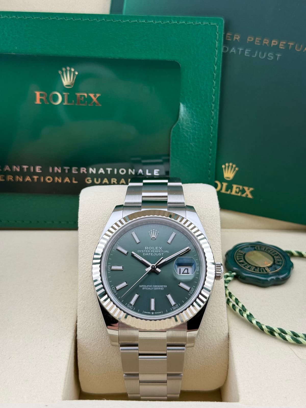 Rolex Datejust 41 Mint Green Dial Oyster 126334 - Silver watch with green dial in a Rolex box