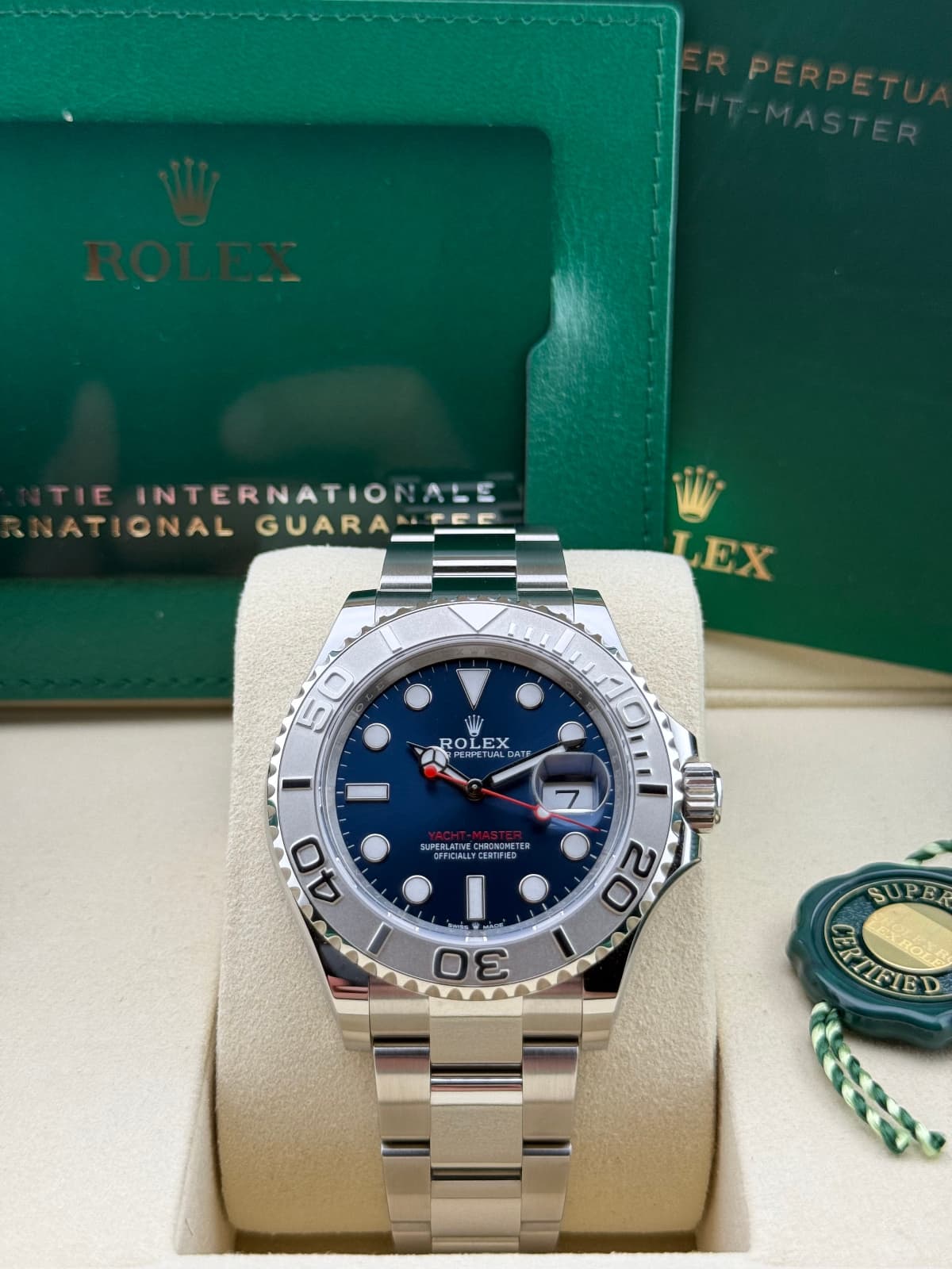 Rolex Yacht-Master 40 Blue 126622 - watch with blue dial and silver case on display with a green box in the background